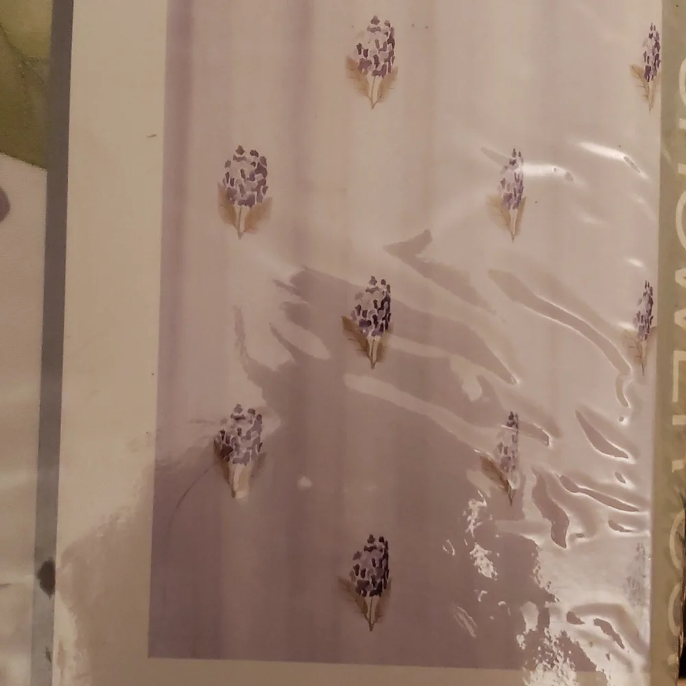 Shower curtain with magnetic liner